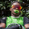 Detail Lifestyle Image of Youth 7v7 Football Player Wearing Warheads Sour Green Apple Max AirFlow Football Mouthguard